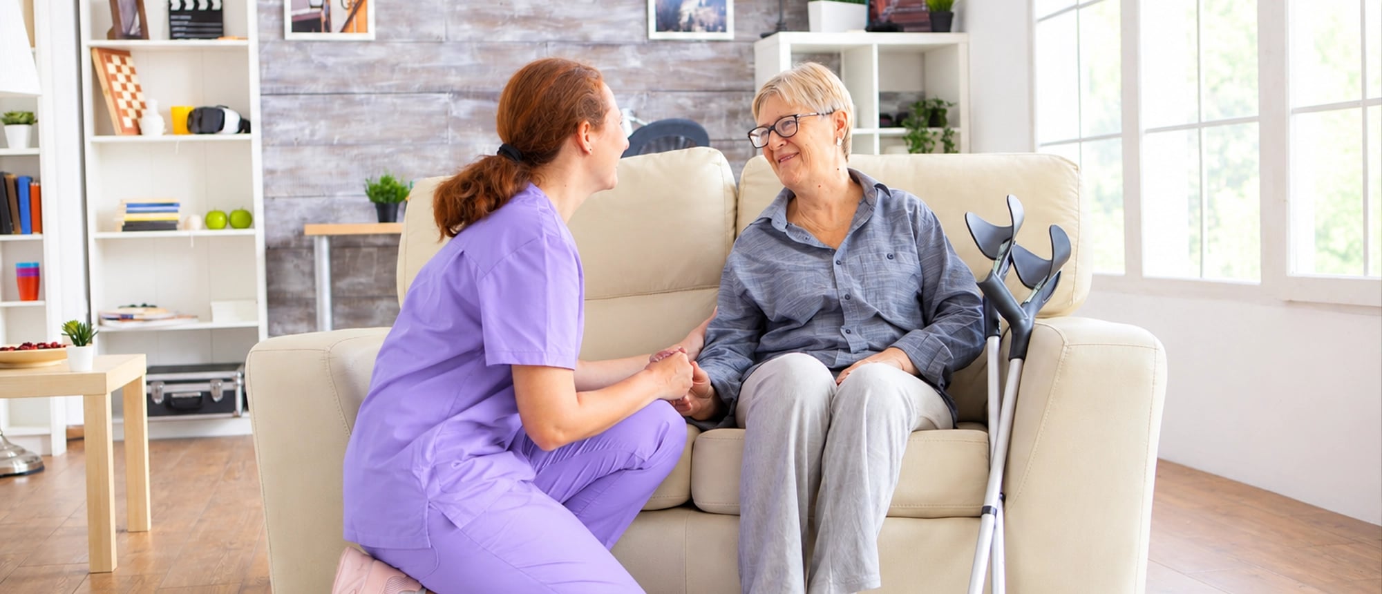 A caregiver gently helping with an everyday task